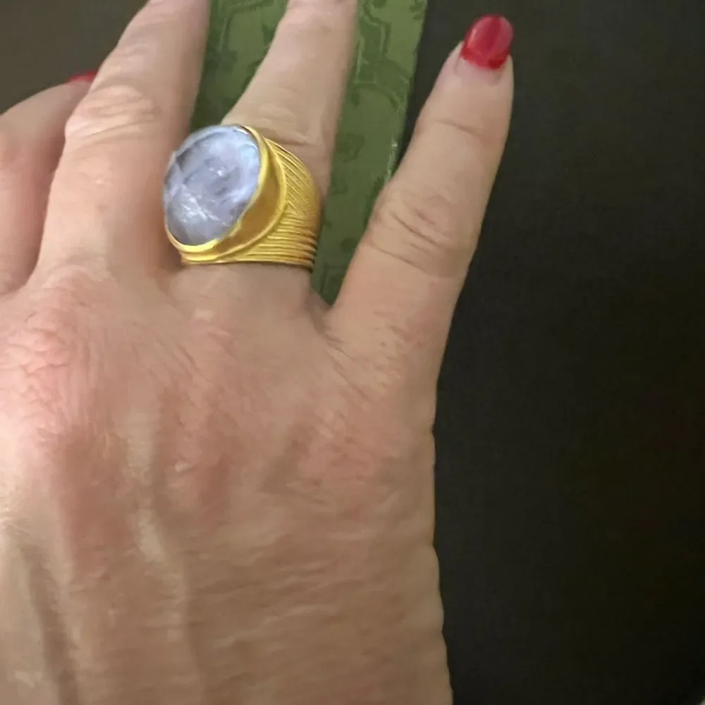 Julie vos Elegant Gold and Purple Ring